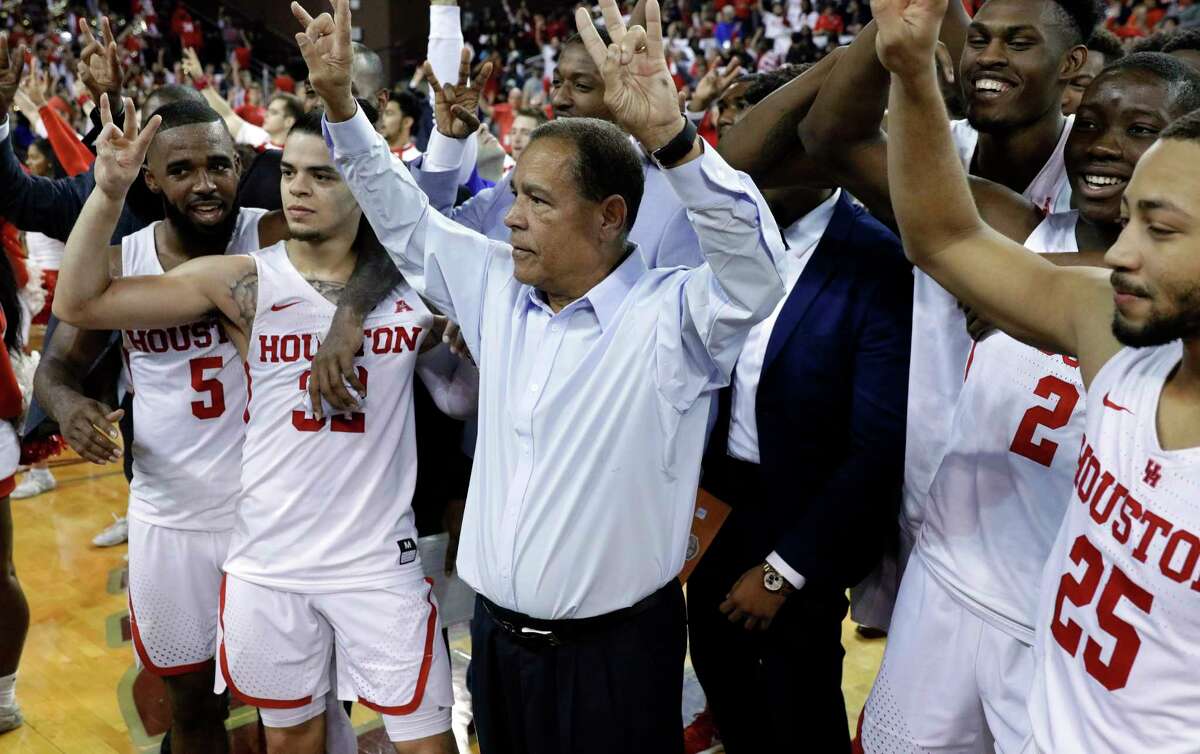 Houston head coach Kelvin Sampson and his players celebrate the 73-59 upset win over Wichita State after their game at H&PE Arena at Texas State University Saturday, Jan. 20, 2018, in Houston, TX. (Michael Wyke / For the Chronicle)