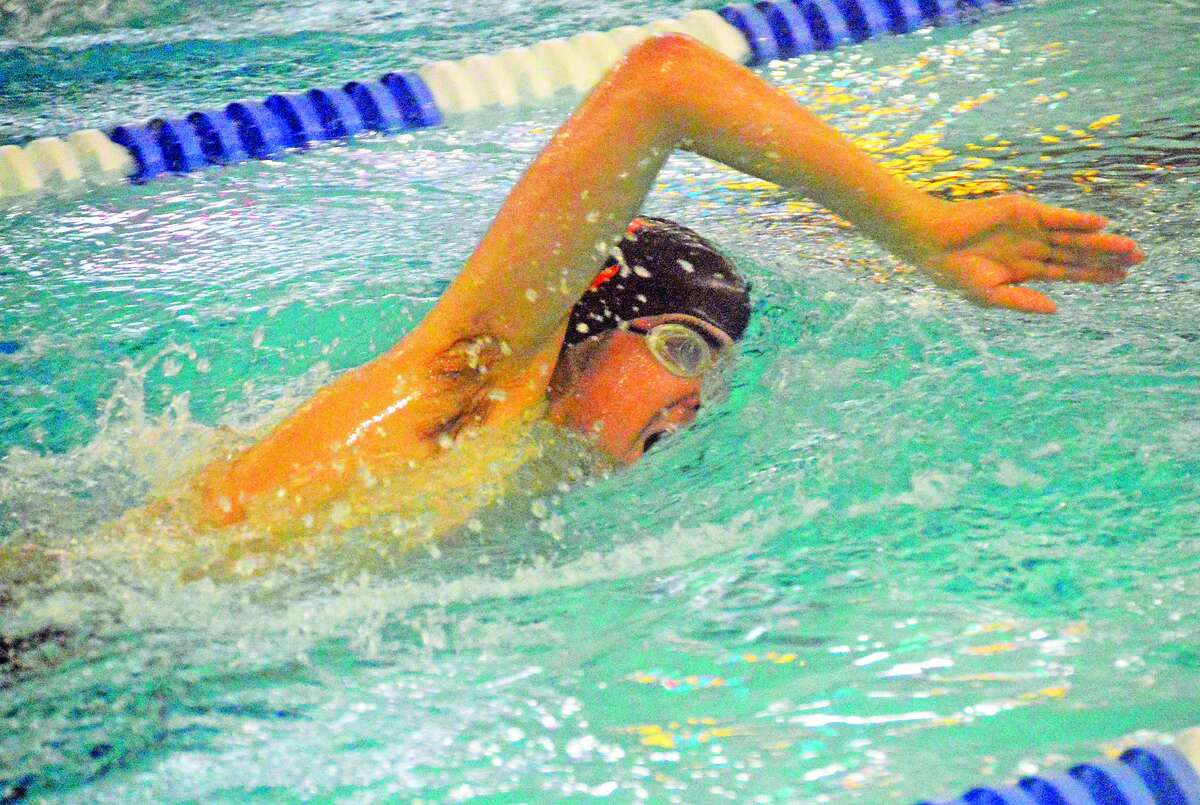 Edwardsville’s Trent Sholl competes in the 500-yard freestyle event during Saturday’s dual meet against Chatham Glenwood inside the Chuck Fruit Aquatic Center.