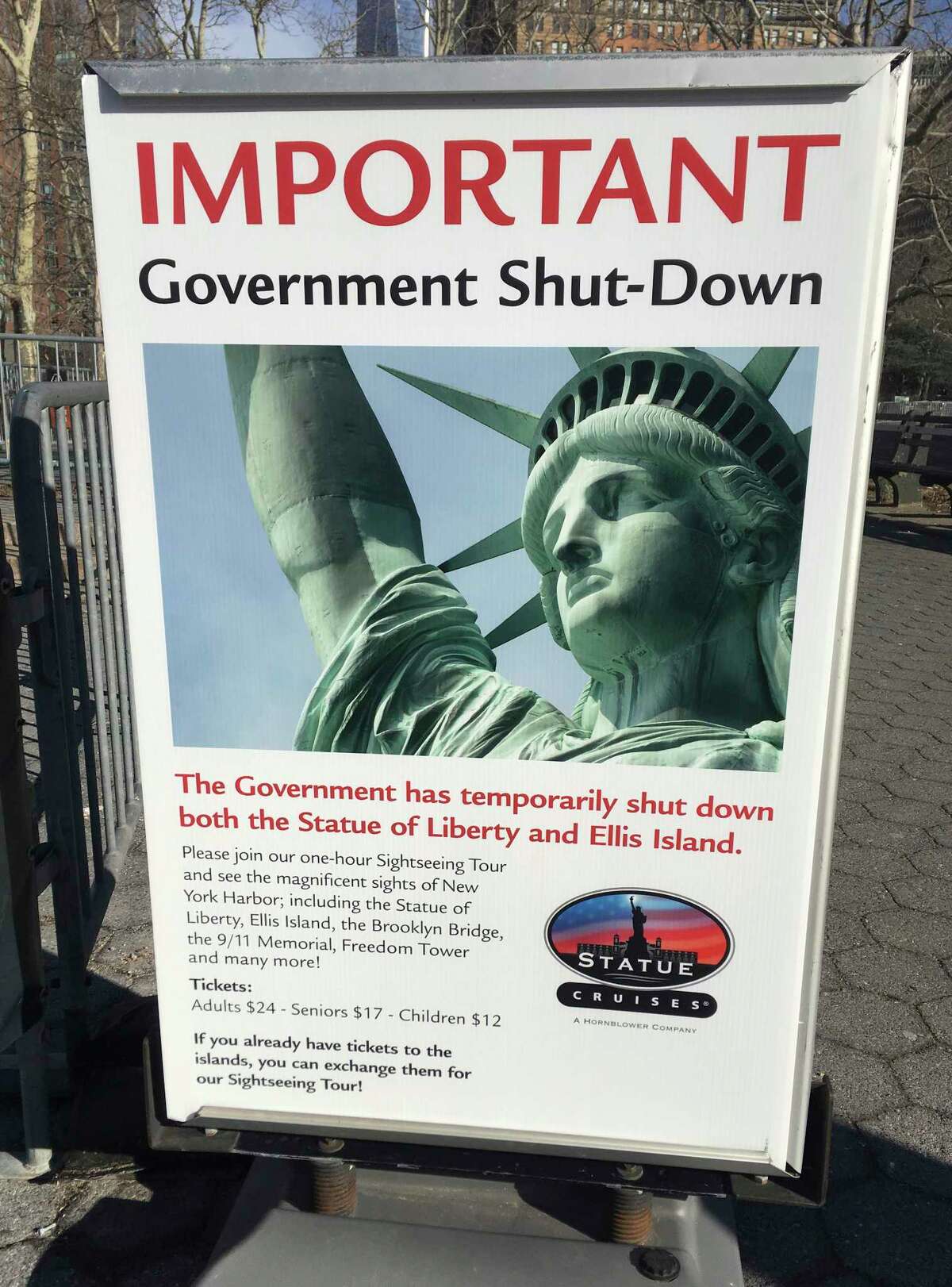 The sign at the Ellis Island ferry cue informs visitors that there was no access to the island or to the Statue of Liberty, due to the government shutdown, Saturday, Jan. 20, 2018 in New York. When a dispute in Congress over spending and immigration forced scores of federal government agencies and outposts to close their doors, the Statue of Liberty and Ellis Island had to turn away visitors, due to what the National Park Service described as "a lapse in appropriations." (AP Photo/Ted Shaffrey)