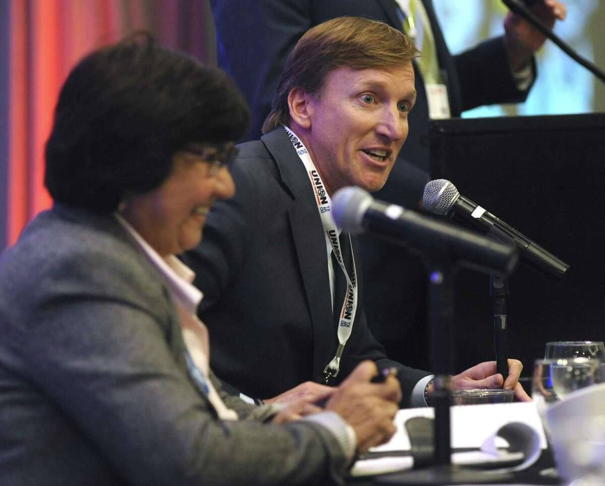 Democratic gubernatorial candidate Andrew White, right, speaks as fellow candidate Lupe Valdez, left, listens at a forum at Texas AFL-CIO's COPE convention at the Sheraton Austin hotel on Saturday, Jan. 20, 2018.