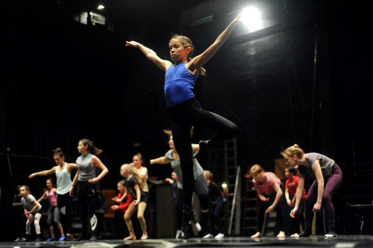 12-year-old Meghan Ferris, of Monroe, leaps during a contemporary master class during DanceFest, a two-weekend experience with master classes taught by prestigious instructors in seven genres, on the Harman Stage at the Palace Theatre in downtown Stamford, Conn. on Sunday, Jan. 21, 2018.