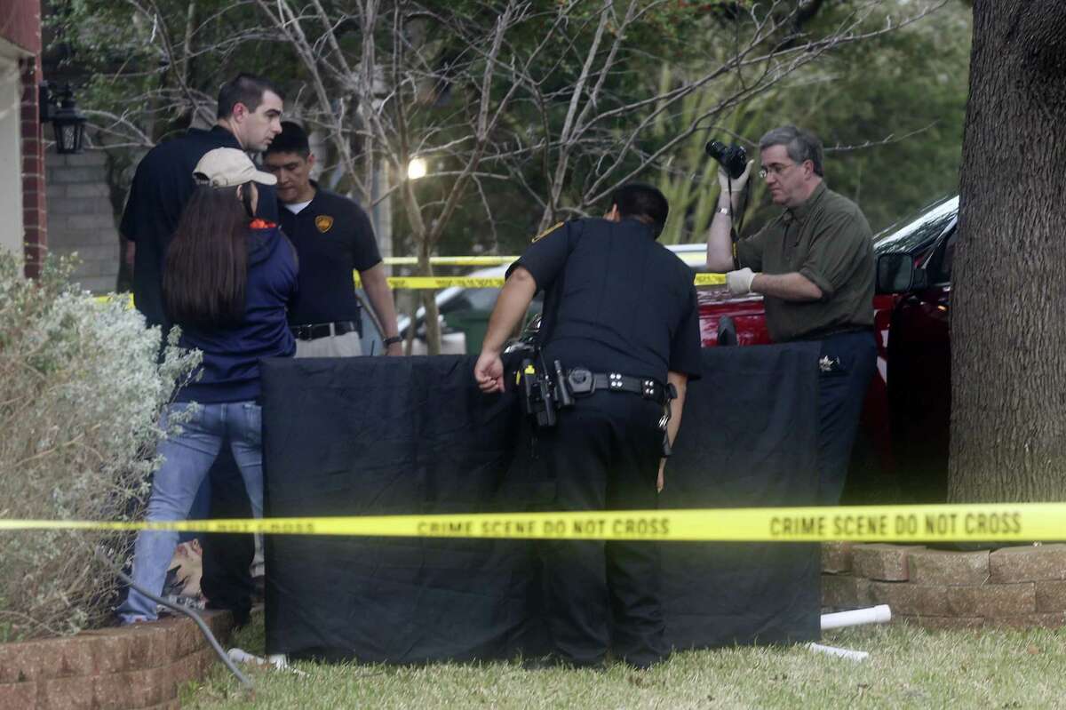 San Antonio Police investigate the scene where a woman was shot dead at 10428 Arbor Bluff, Sunday, Jan. 21, 2018. Police issued a lookout for the suspect, Richard Concepcion, 37, who was driving at white Toyota Tundra and was with hi 18-month-old son. He was later found with a gunshot with a self-inflicted gunshot in Guadalupe County and his son was found safe.