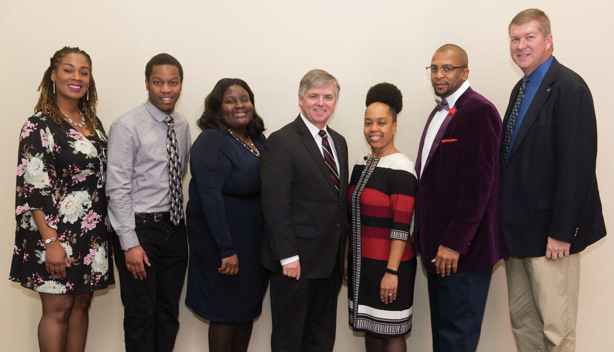 Celebrating another Dr. Martin Luther King Jr. Birthday Celebration at SIUE from left to right: community humanitarian award winner Desiree Tyus, scholarship winner Jonathan Amwayi, faculty humanitarian award winner Dr. Jessica Harris, Chancellor Randy Pembrook, featured speaker Dr. Shonta Smith, staff humanitarian award winner Shawn Roundtree and Vice Chancellor for Student Affairs Jeffrey Waple.