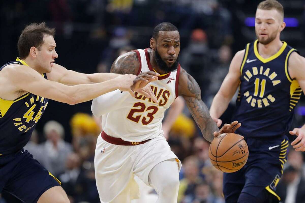 LeBron James rarely gets called for travelling according to Norman Chad. Here James dribbles against Indiana’s Bojan Bogdanovic during a Jan. 12, 2018 game in Indianapolis.