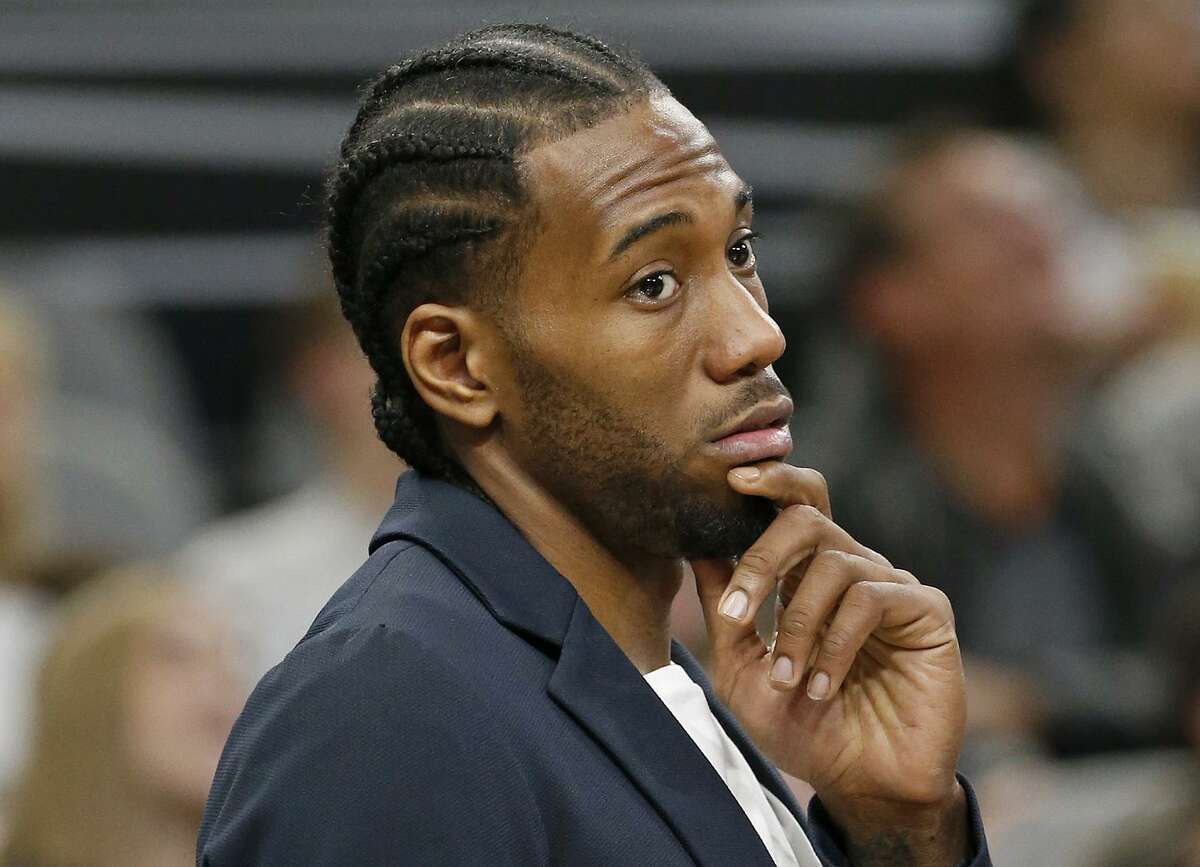 San Antonio Spurs' Kawhi Leonard stands near the bench during a timeout in first half action against the Indiana Pacers Sunday Jan. 21, 2018 at the AT&T Center.