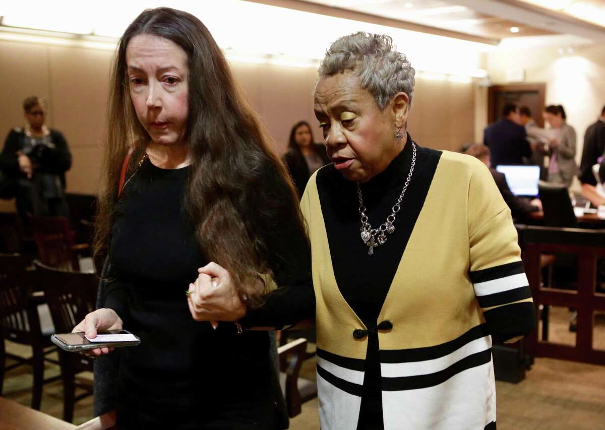 Doris Mixon Smith, right, whose arm was ripped off by a pit bull named Bully owned by Alphonso McCloud and his wife, Stanyelle McCloud, walks with Kelly Walls, who tracks aggressive dog reports, after closing arguments in the 187th state District Court, presided by Judge Joey Contreras in the Cadena-Reeves Justice Center, on Monday, Jan. 22, 2018.