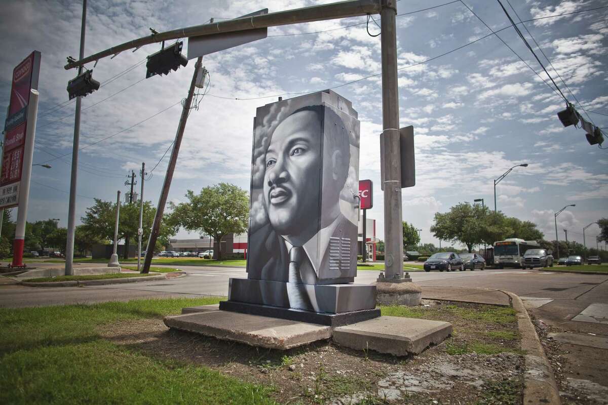 W3R3ON3 painted this mini-mural in honor of Dr. Martin Luther King at the corner of West Fuqua and White Heather Dr.