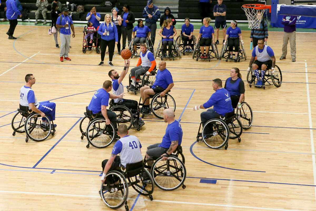 Teams compete in a wheelchair basketball game in a Warrior CARE event at Joint Base San Antonio-Randolph on Friday, Jan 12, 2018. The event, run by the Air Force Personnel center, included wheelcahir basketball, sitting volleyball, swimming, air pistol and rifle shooting, archery, cycling and trank and field competitions including shot put, discus and running events. MARVIN PFEIFFER/mpfeiffer@express-news.net