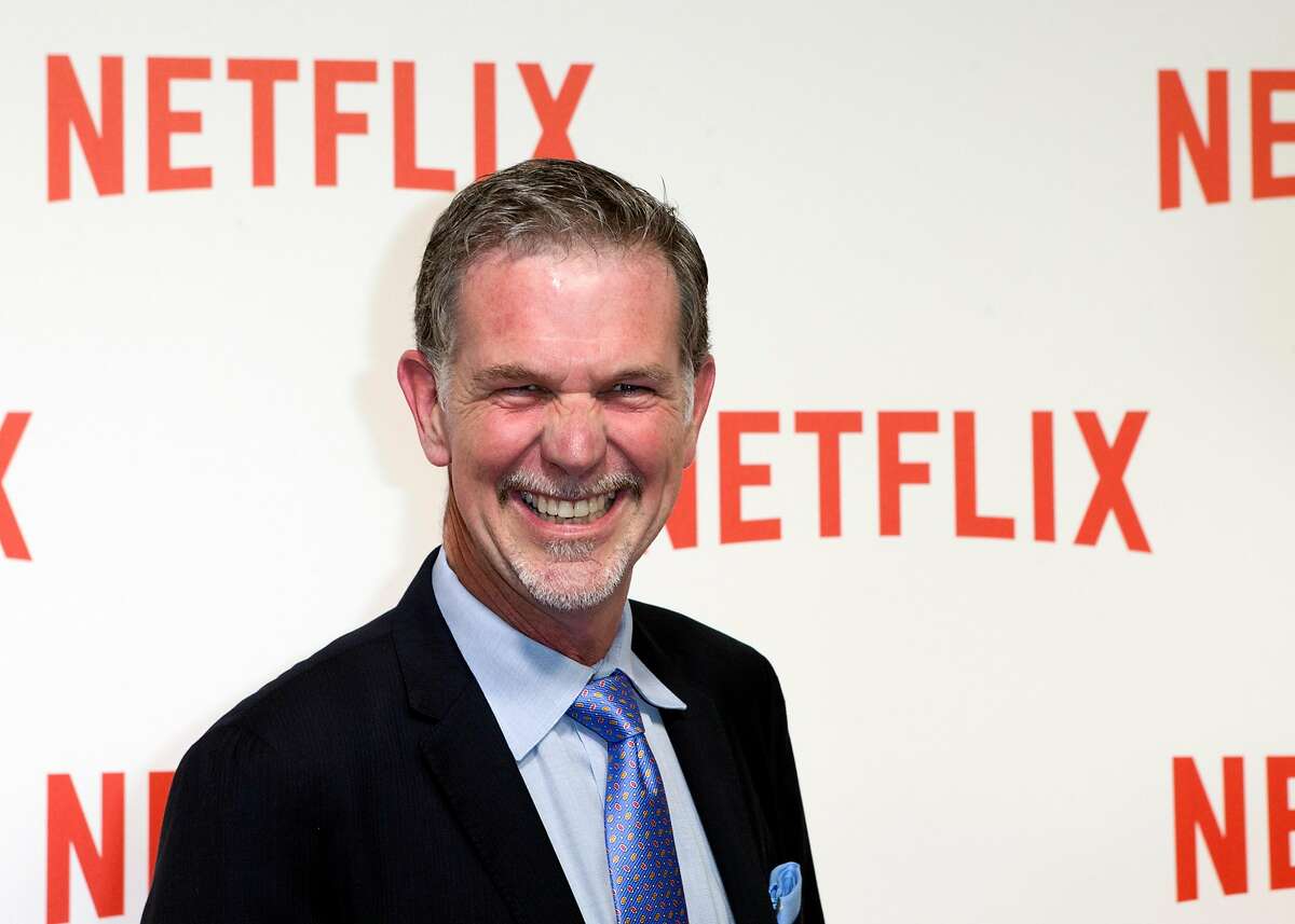 FILE - In this Sept. 15, 2014, file photo, Netflix CEO Reed Hastings arrives for the 'Netflix' Launch Party in Paris. Hastings made the surprise announcement at the end of a presentation Wednesday, Jan. 6, 2016, in Las Vegas at CES, a showcase for gadgets and technology services. Netflix has begun streaming its Internet video service in 130 more countries, nearly completing its expansion a year ahead of schedule. (AP Photo/Jacques Brinon, File)