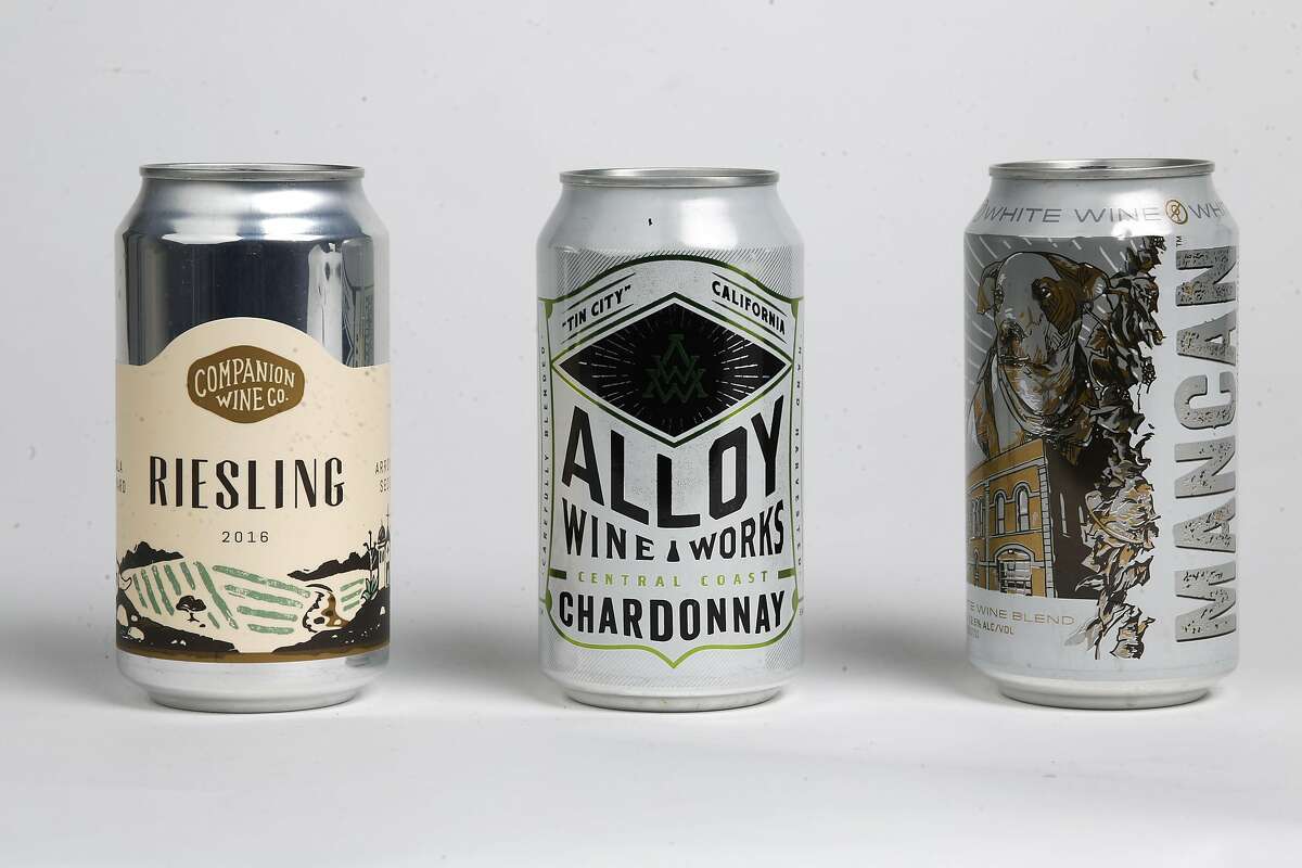 Wines in a can, as seen on Tuesday, Jan. 16, 2018 in San Francisco Studio, Calif. Companion Wine Co. 2016 Riesling, Alloy Wine Works Central Coast Chardonnay and Mancan White Wine blend.