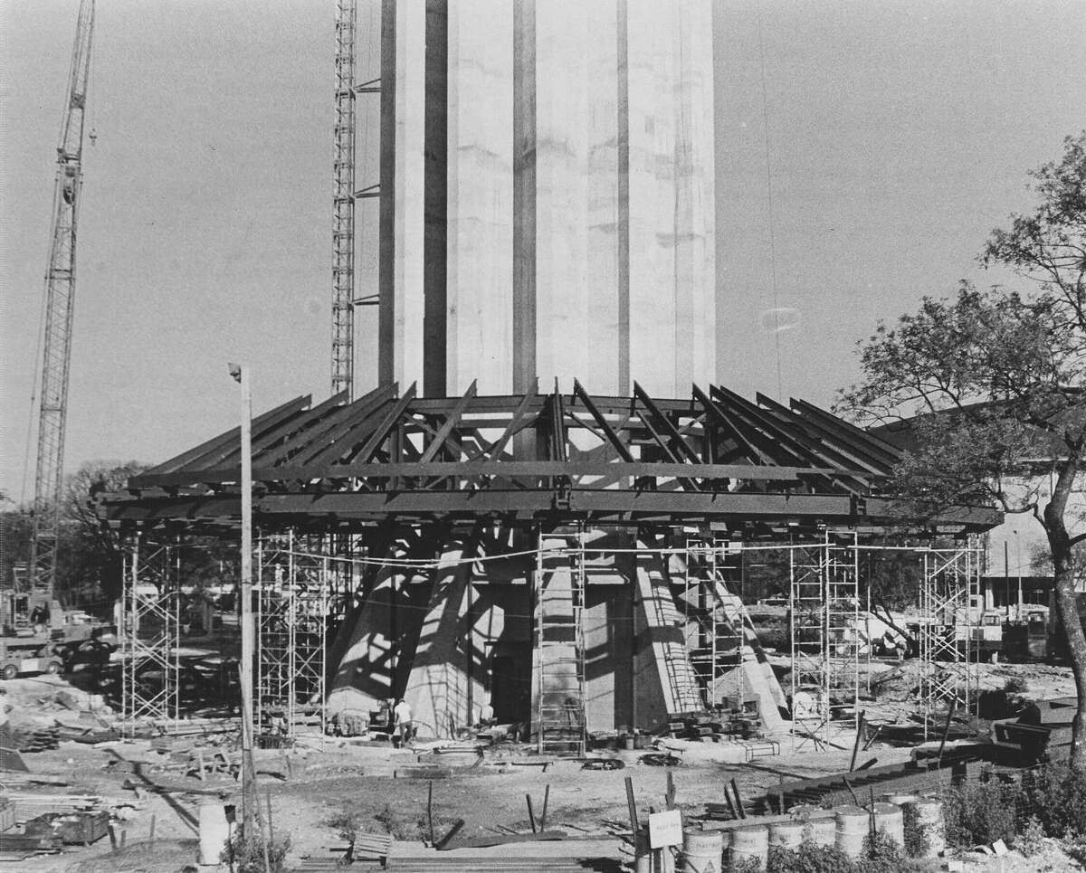 Caption published in the News, Sept. 14, 1967: "The top of the Tower of the Americas top house has taken shape around the base of the tower and workmen will soon start adding the floors beneath. When the framework is completed it will be lifted to the top of the tower. The tower grew eight feet last weekend (Sept. 9-10) for the tallest climb in three weeks. There will be no more concrete pouring for at least five weeks. The tower now stands 602 feet tall." When completed, the tower is 622 feet tall.
