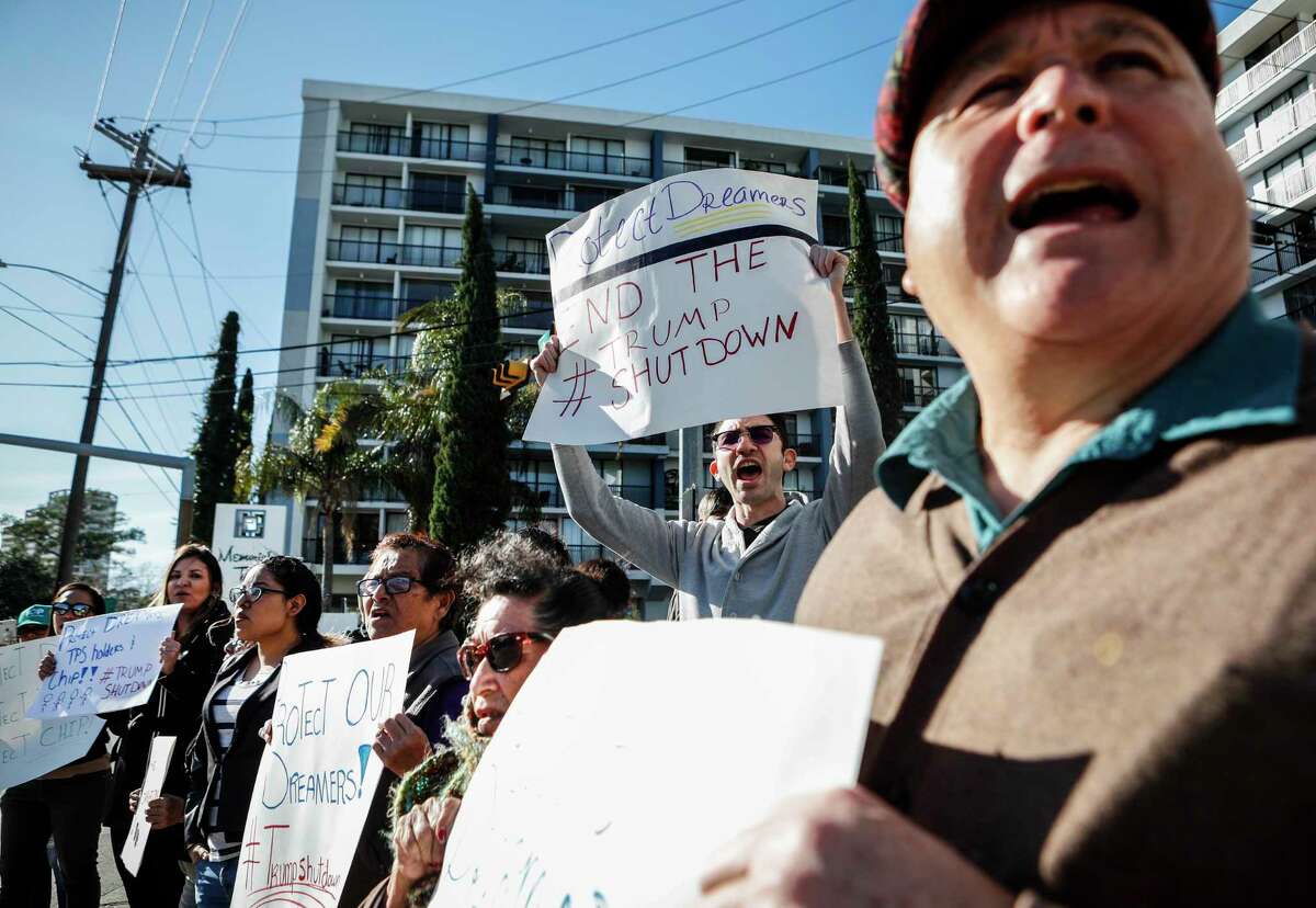 Demonstrators protest the shutdown outside the office of Sen, John Cornyn, R-Texas, on Monday in Houston. ﻿ Later, a deal was worked out to reopen the government.