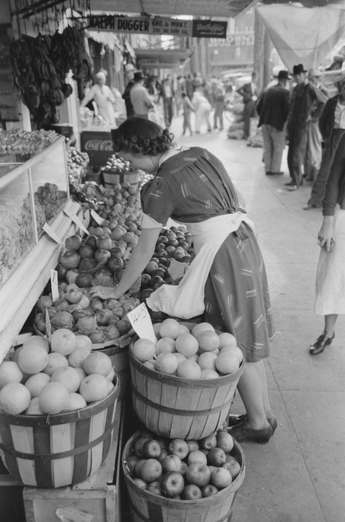 Saleswoman at Grocery Store, Waco, Texas, USA, Russell Lee, November 1939. (Photo by: Universal History Archive/UIG via Getty Images)