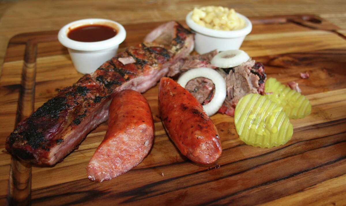 The Medieval Grille trinity includes pork spare ribs, brisket and sausage.