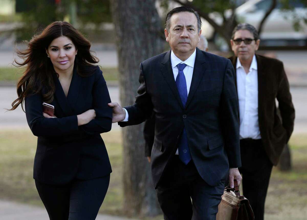 Former state Sen. Carlos Uresti and his now ex-wife, Lleanna Elizondo, arrive at the San Antonio federal courthouse for the second day of his criminal trial in 2018. The federal government and Elizondo are now involved in a dispute over the pension Uresti earned as an elected official.