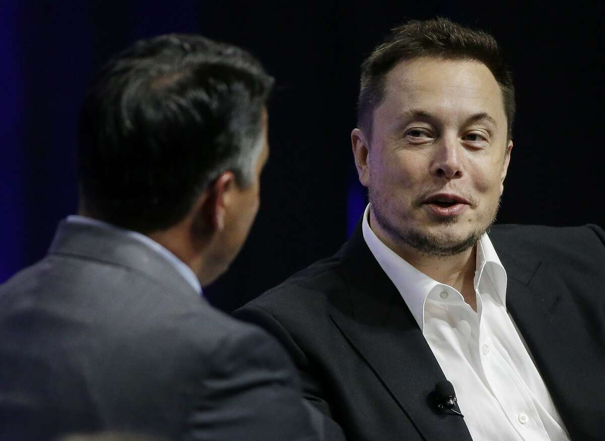 FILE - In this July 15, 2017, file photo, Tesla and SpaceX CEO Elon Musk responds to a question by Nevada Republican Gov. Brian Sandoval. Musk demonstrated a soon-to-be-released flamethrower from his Boring Company on social media Saturday, saying the company's website is accepting pre-orders for the item.