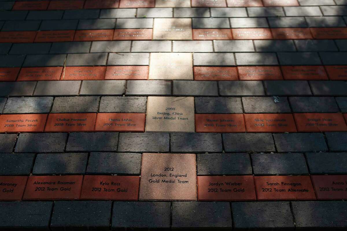 A walk of fame holds bricks for the USA Gymnastics teams and members who have trained at the Karolyi's facility near New Waverly, Wednesday, May 4, 2016, in Houston. ( Mark Mulligan / Houston Chronicle )