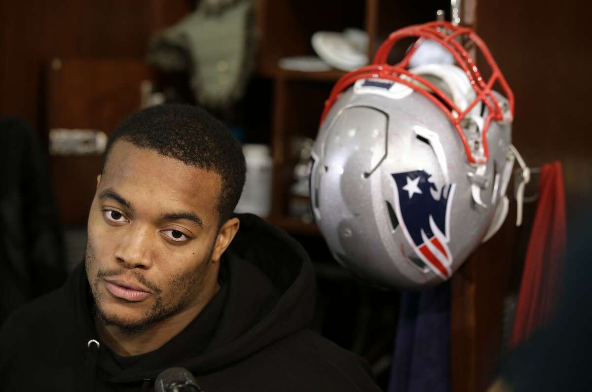 FILE - In this Jan. 18, 2018, file photo, New England Patriots defensive end Trey Flowers faces reporters in the team's locker room following an NFL football practice, in Foxborough, Mass. Flowers has been one of the most consistent players for the Patriots on defense this season. Despite sitting out two games late in the season with a ribs injury, Flowers led the team during the regular season with 6 1/2 sacks (AP Photo/Steven Senne, File)