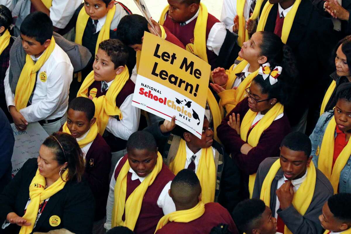 Students from charter, private, parochial and home schools, participate in a school choice proponents rally Tuesday, Jan. 23, 2018, at the Capitol in Jackson, Miss., as prospects remain unclear for House and Senate bills that would expand programs to spend public money to pay for students to attend private schools. (AP Photo/Rogelio V. Solis)