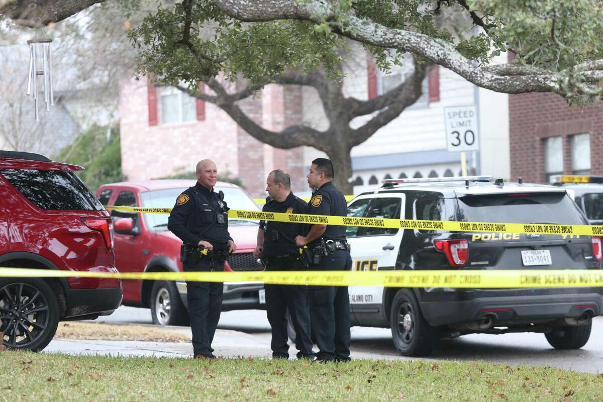 San Antonio Police investigate the scene where a woman was shot dead at 10428 Arbor Bluff, Sunday, Jan. 21, 2018. Police issued a lookout for the suspect, Richard Concepcion, 37.