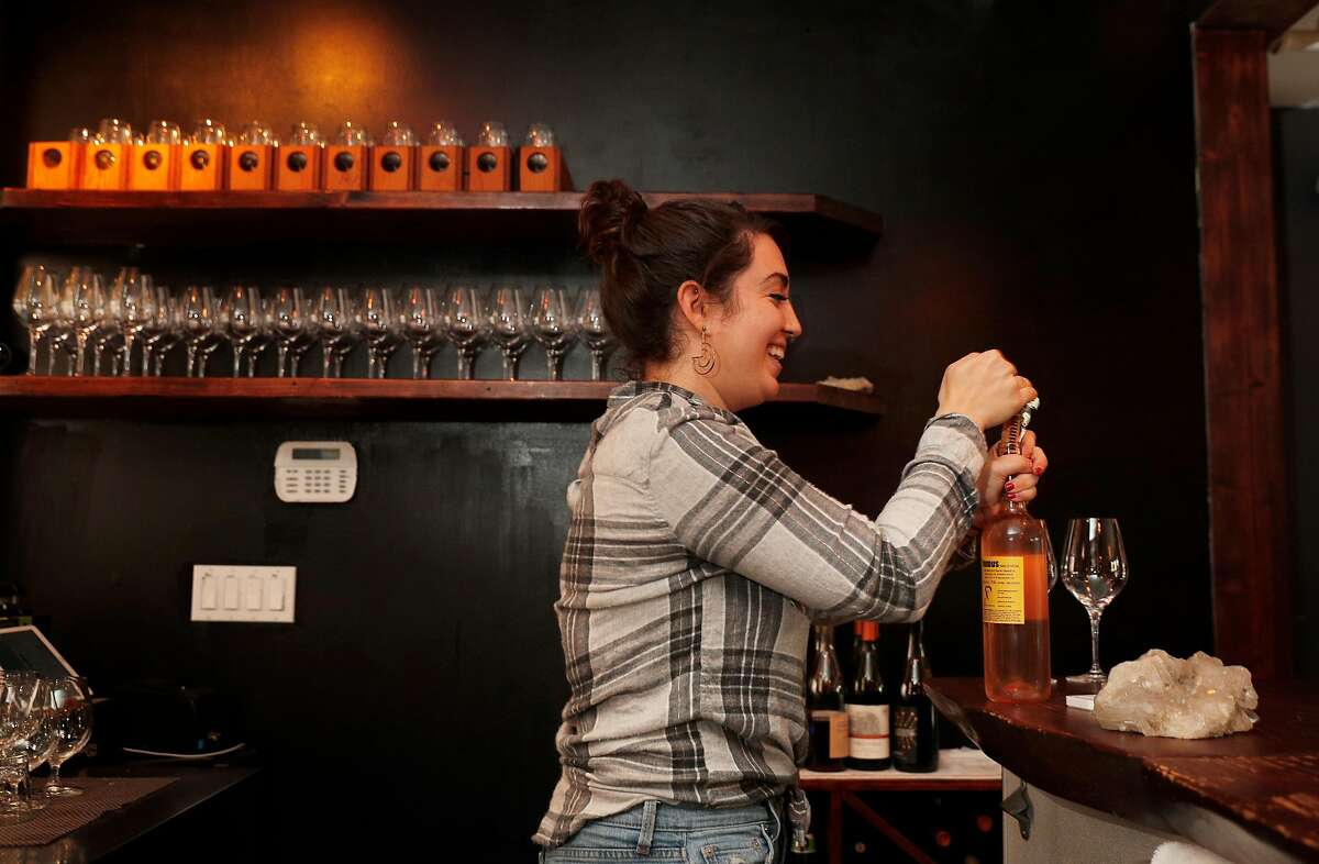 Allee Cakmis works the bar pouring drinks and making small plates at the Fig and Thistle Wine Bar in San Francisco, Calif., on Sunday, January 21, 2018.