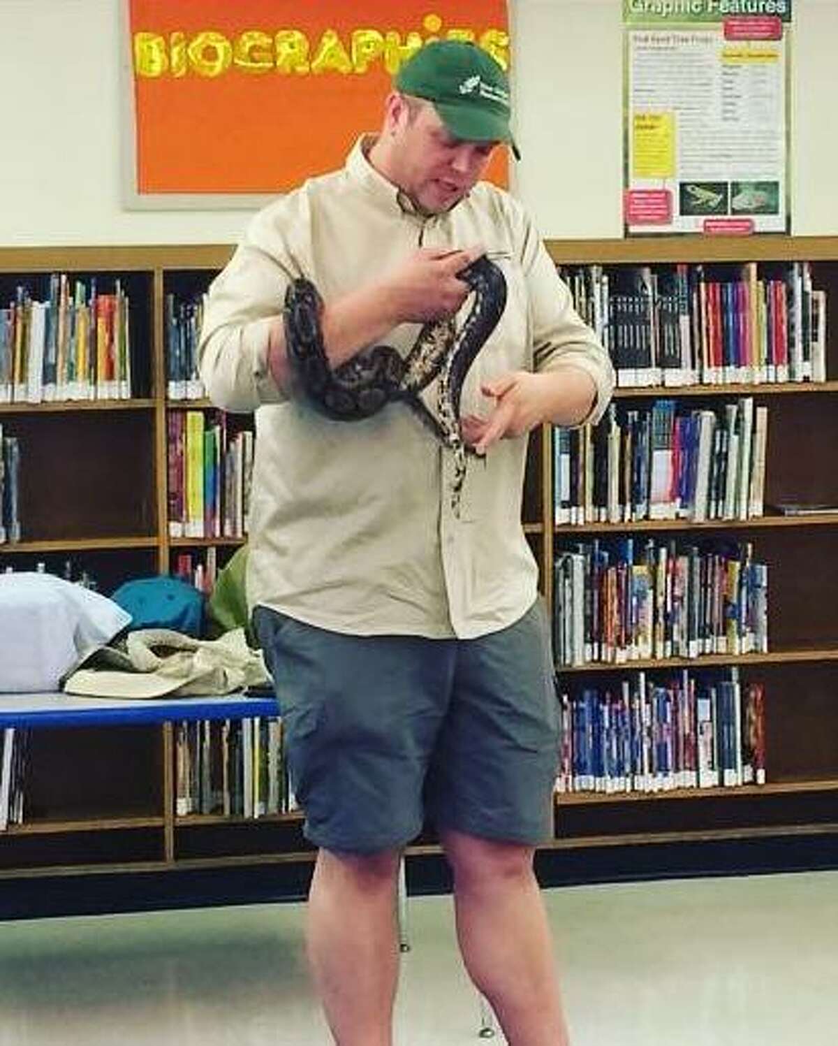 Bill Flynn, director of animal care at the New Canaan Nature Center, shows his slippery, wriggly friend to New York City children as part of the nature centers program that brings environmental education to thousands of city kids each year.