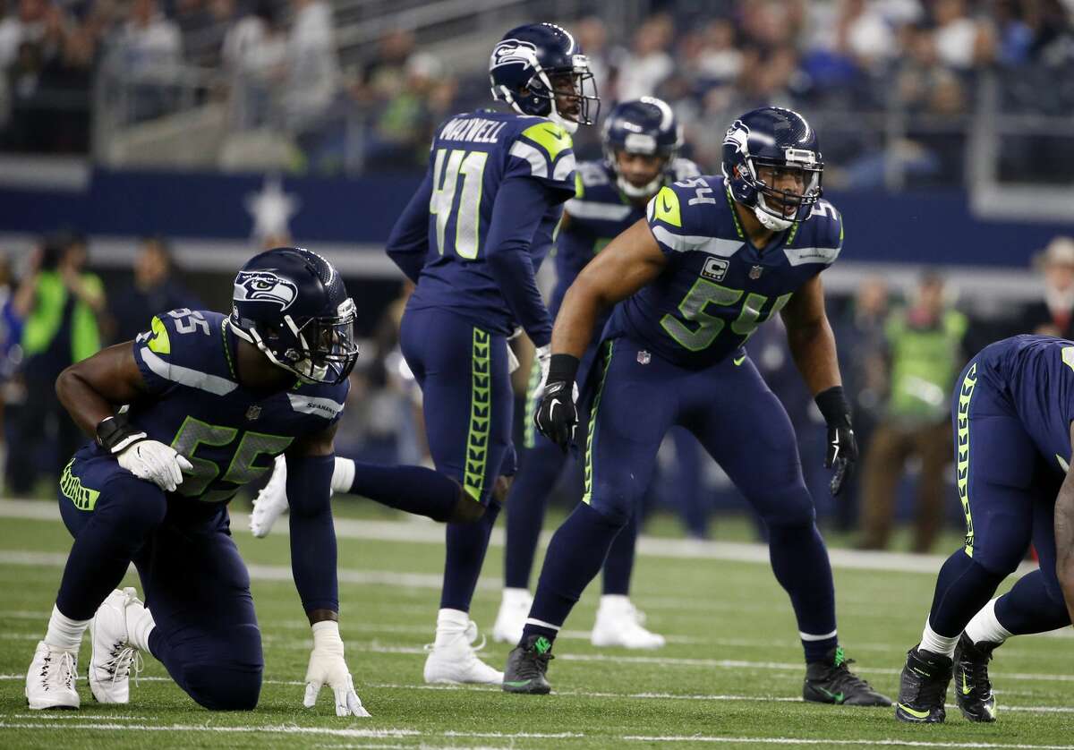 Seattle Seahawks defensive end Frank Clark (55), cornerback Byron Maxwell (41) and middle linebacker Bobby Wagner (54) decend against the Dallas Cowboys during an NFL football game, Sunday, Dec. 24, 2017, in Arlington, Texas. (AP Photo/Michael Ainsworth)