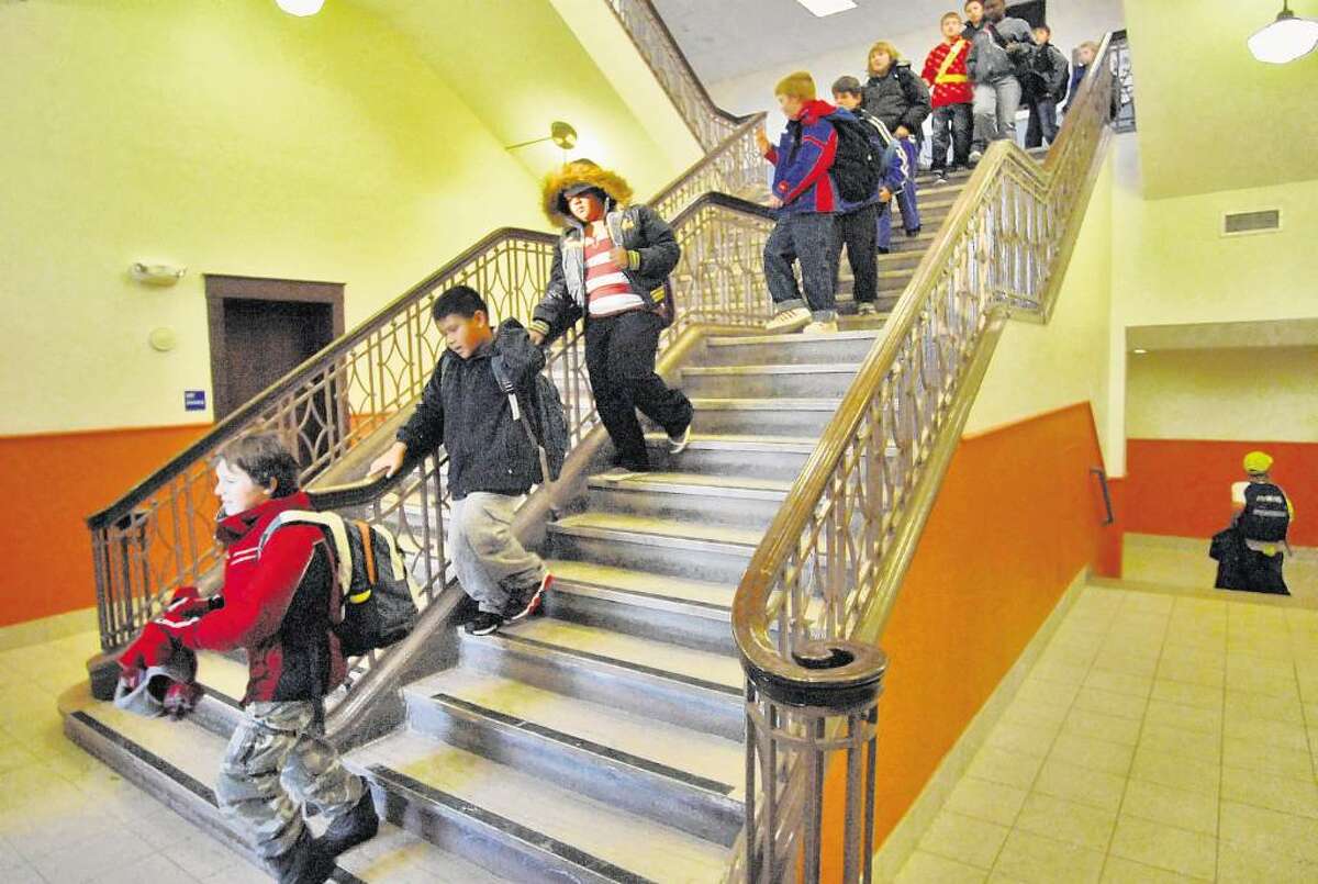 Students head for the door at the refurbished New Scotland Elementary School in Albany. The district is looking at ways to cope with the growth of charter schools. (Phil Kamrass/Times Union)