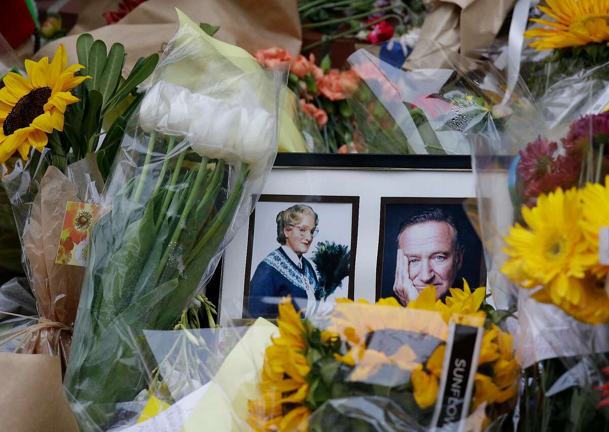 Flowers and photographs on Aug. 15, 2014 in San Francisco, a makeshift memorial for actor Robin Williams outside the home which was used in the filming of the movie "Mrs. Doubtfire."