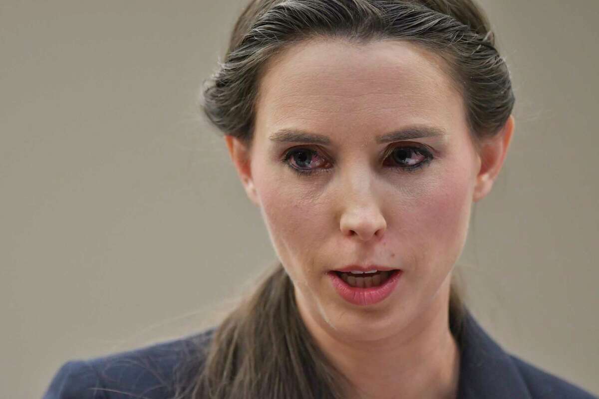 Rachael Denhollander addresses Larry Nassar before his sentencing Wednesday, Jan. 24, 2018, during the final day of victim impact statements in Lansing, Mich. The former sports doctor who admitted molesting some of the nation's top gymnasts for years was sentenced Wednesday to 40 to 175 years in prison as the judge declared: "I just signed your death warrant." The sentence capped a remarkable seven-day hearing in which scores of Nassar's victims were able to confront him face to face in the Michigan courtroom. (Matthew Dae Smith/Lansing State Journal via AP)