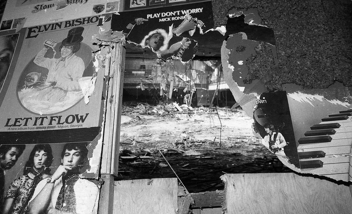 Sept. 17, 1985: A wall filled with concert posters has a hole in it, revealing the partially demolished interior of the Winterland Ballroom.