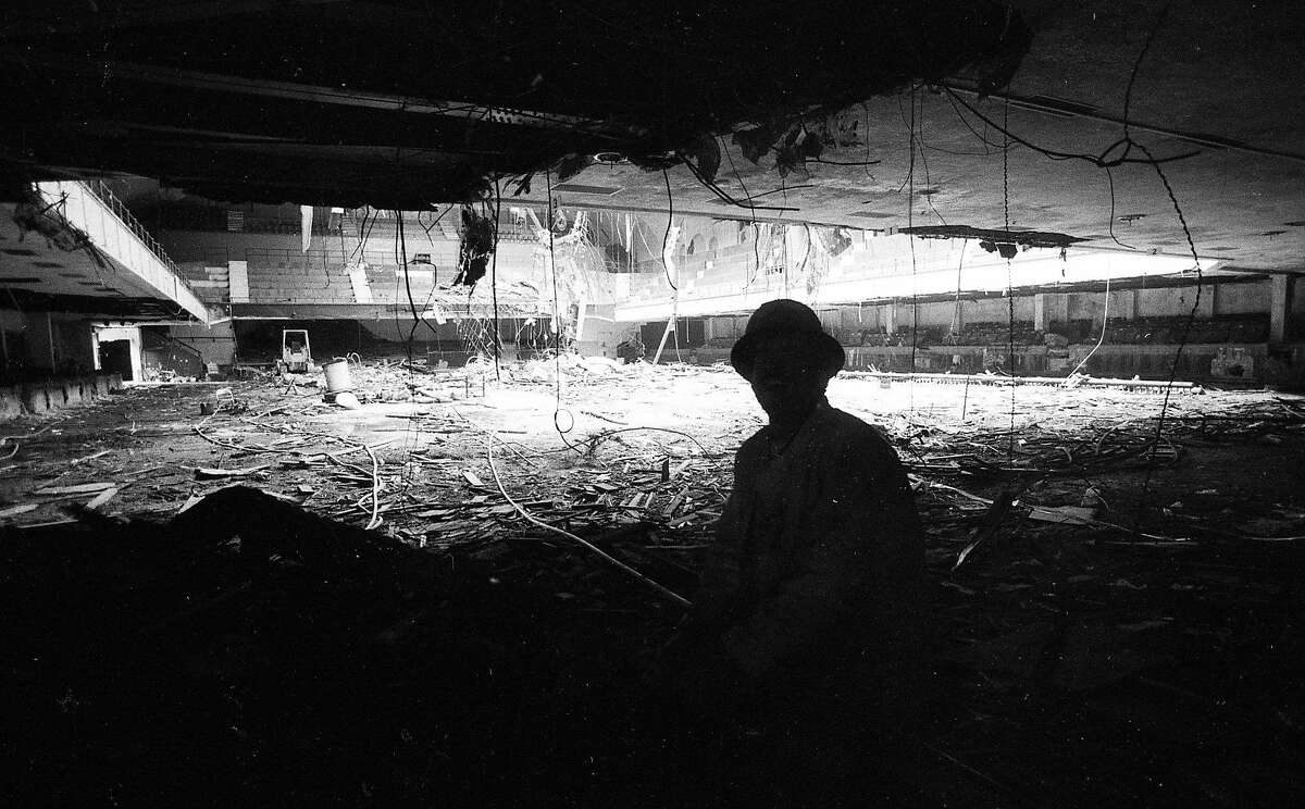 Sept. 17, 1985: A worker in the shadows looks at the interior of the Winterland Ballroom during its 1985 demolition.