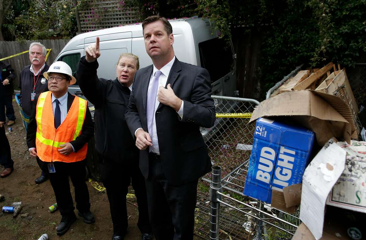 San Francisco Interim Mayor Mark Farrell visits the fire scene of an overnight blaze with fire chief Joanne Hayes White that destroyed a hardware store and several other businesses were damaged, in the west portal neighborhood of San Francisco, Calif., as seen on Wednesday Jan. 24, 2018.