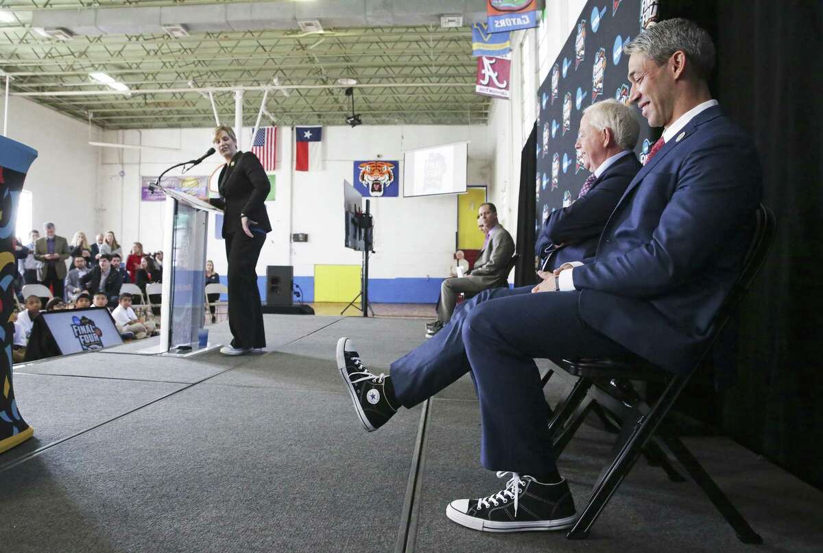 Mayor Ron Nirenberg kicks up his sneaker as leaders gather at Higgs Carter & King School gymnasium to announce key details for the NCAA Final Four Legacy Project on January 24, 2018.