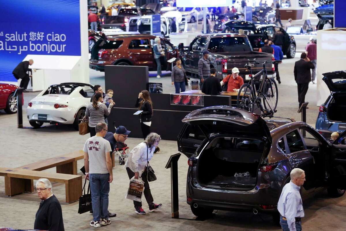 People browse through the Mazda display space during the first day of the Houston Auto Show at NRG Center Wednesday, Jan. 24, 2018 in Houston. ( Michael Ciaglo / Houston Chronicle)