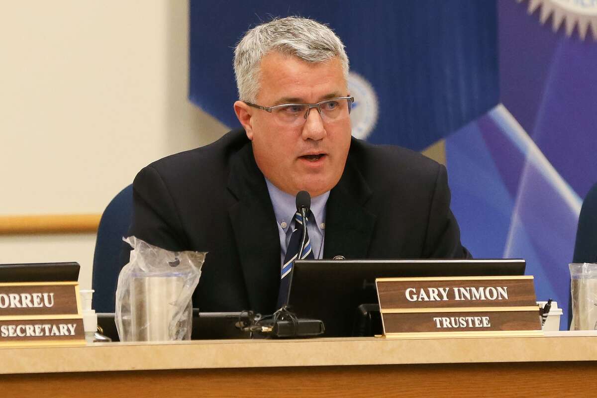 Longtime Schertz-Cibolo-Universal City ISD trustee Gary Inmon reads a statement in his defense early last January during the first meeting of the school board after his arrest on an assault charge. On Wednesday, he pleaded guilty to unrelated charges stemming from his handling of an estate as an attorney.