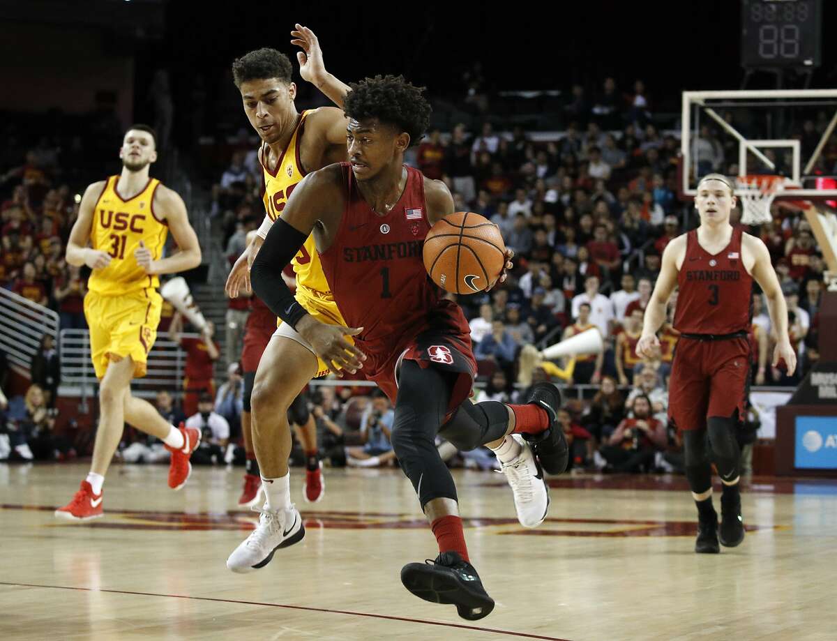 Stanford's Daejon Davis drives past Southern California's Derryck Thornton during the first half of an NCAA college basketball game Wednesday, Jan. 24, 2018, in Los Angeles. (AP Photo/Jae C. Hong)