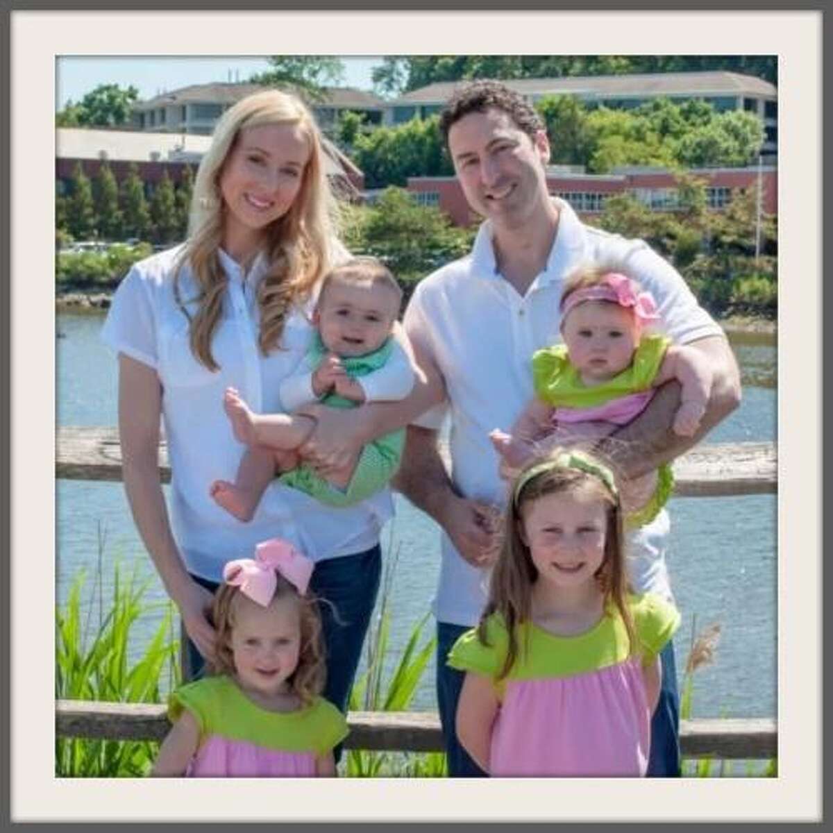 Christine Meiers Schatz and her family stand on the Saugatuck River bridge.