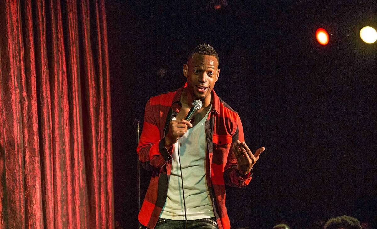 Marlon Wayans doing stand-up comedy.