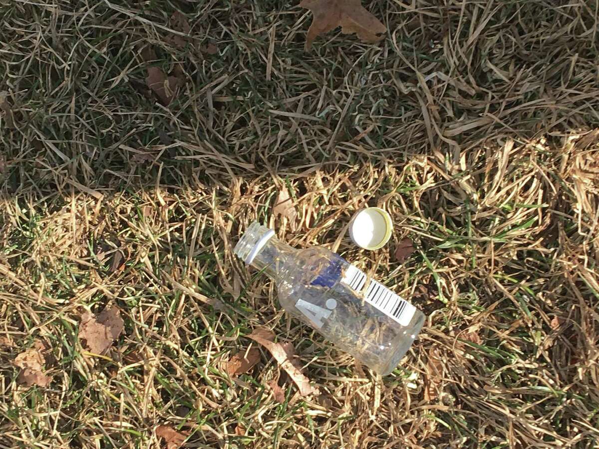 A nip bottle as scene on the grass near the Fairfield traffic circle by I-95.