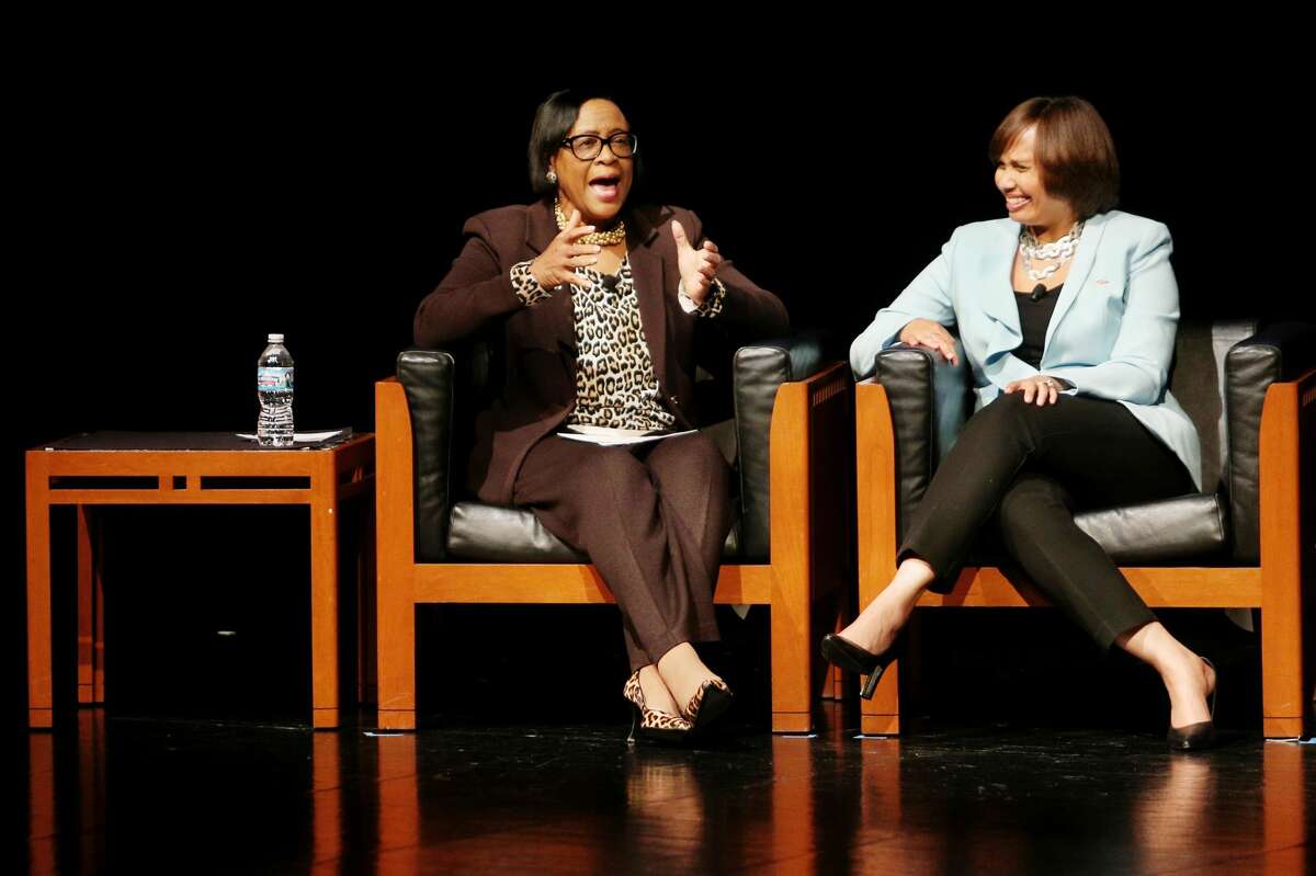 Cynthia "Cynt" Marshall, president and chief executive officer of Marshalling Resources, left, chats with Karen S. Carter, the new chief inclusion officer at Dow, during an open discussion during the MLK Regional Celebration at Saginaw Valley State University on Wednesday, Jan. 24, 2018. (Samantha Madar/for the Daily News)