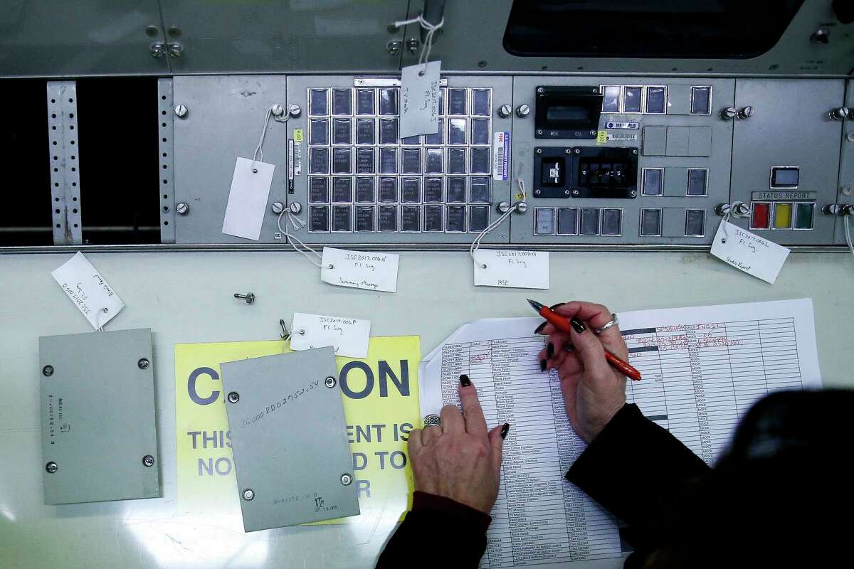 NASA property accountant Marilyn Blevins works to catalogue all the pieces of the flight control consoles at Johnson Space Center's Historic Mission Control as they are prepared for their trip to the Cosmosphere in Kansas for restoration Thursday, Jan. 25, 2018 in Houston.