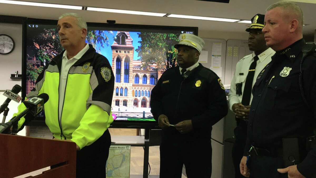 From left: Emergency Operations Deputy Director Rick Fontana, New Haven Fire Chief John Alston Jr., Police Chief Anthony Campbell and New Haven police spokesman Officer David Hartman during a meeting at the city’s emergency operations center on Thursday, Jan. 25, in New Haven.