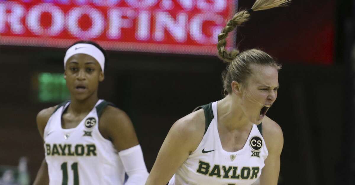 Baylor guard Kristy Wallace, right, reacts after scoring against Texas, next to guard Alexis Morris duringthe first half of an NCAA college basketball game, Thursday, Jan. 25, 2018, in Waco, Texas. (AP Photo/Rod Aydelotte)