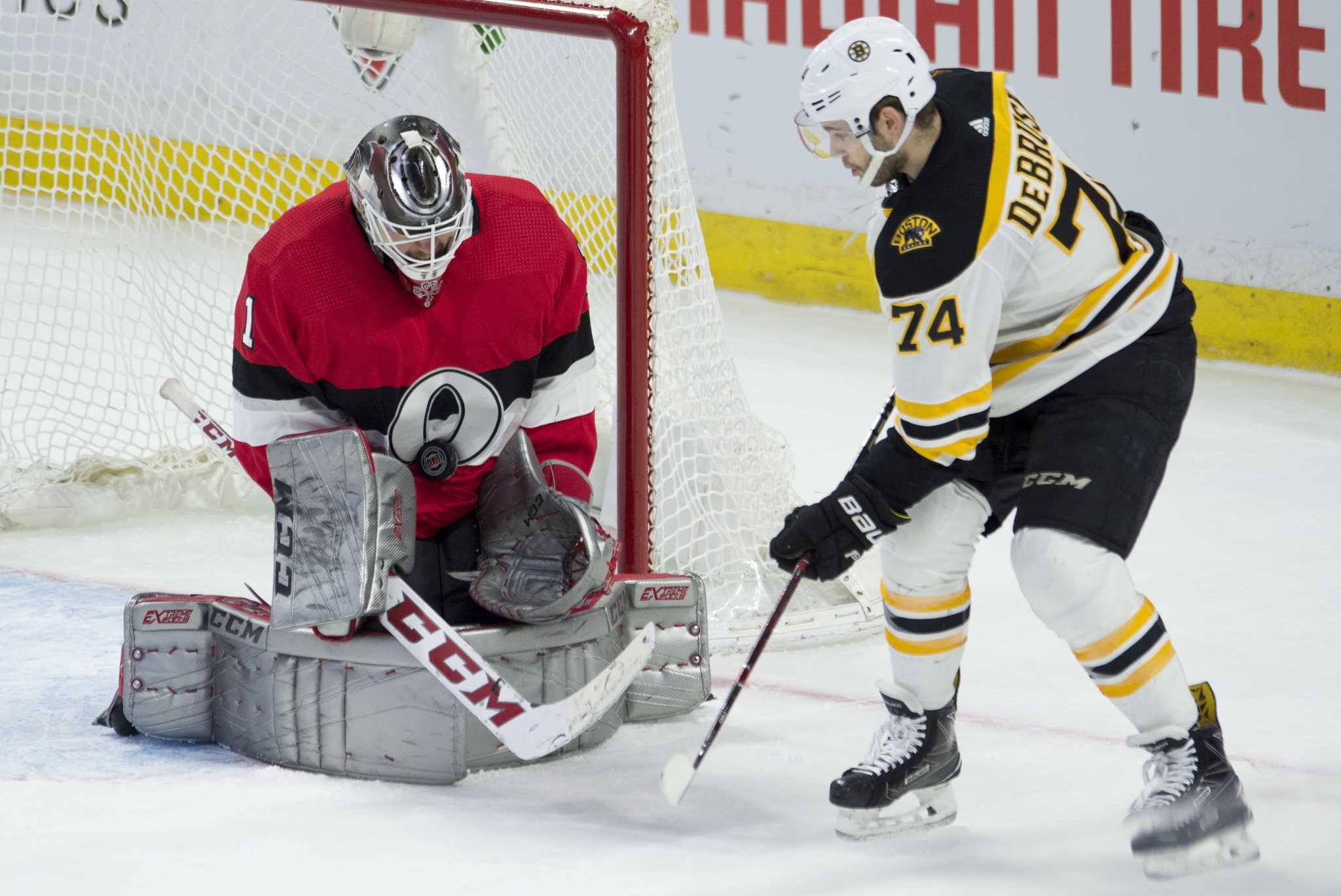 Jake DeBrusk's two third-period goals lift Bruins over Penguins