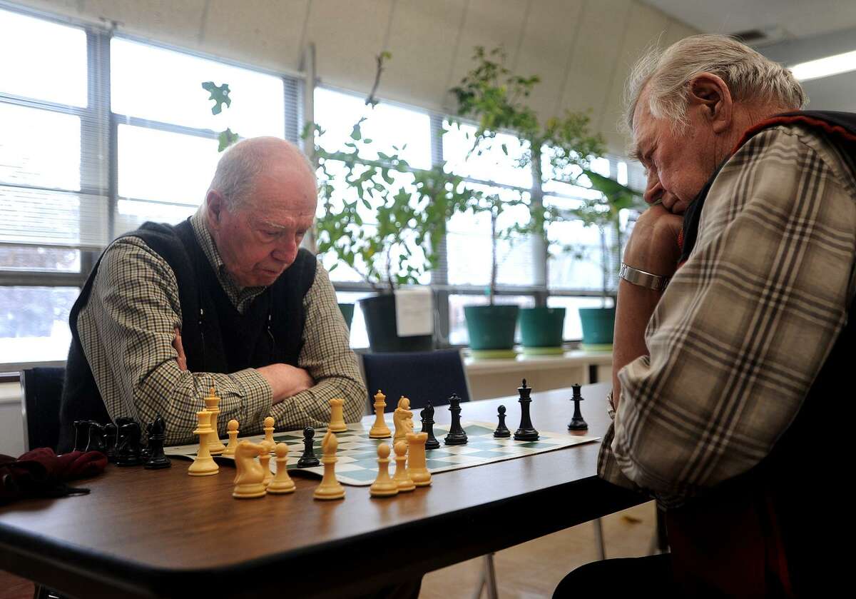 Frank DeStefano, left, of Fairfield, and Teo Perrini, of Shelton, play a game of chess as part of the Fairfield Senior Chess Club at the Bigelow Center for Senior Activities on Jan. 17.