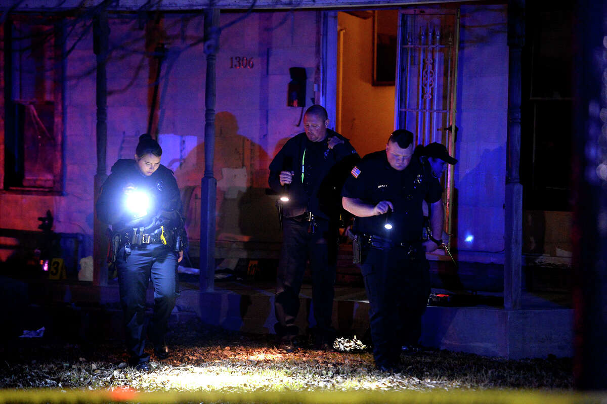 Port Arthur police investigate a shooting in the 1300 block of Trinity Ave. on Thursday night. A department spokesperson said two people were shot in the back of the head; one died at the scene. Photo taken Thursday 1/25/18 Ryan Pelham/The Enterprise
