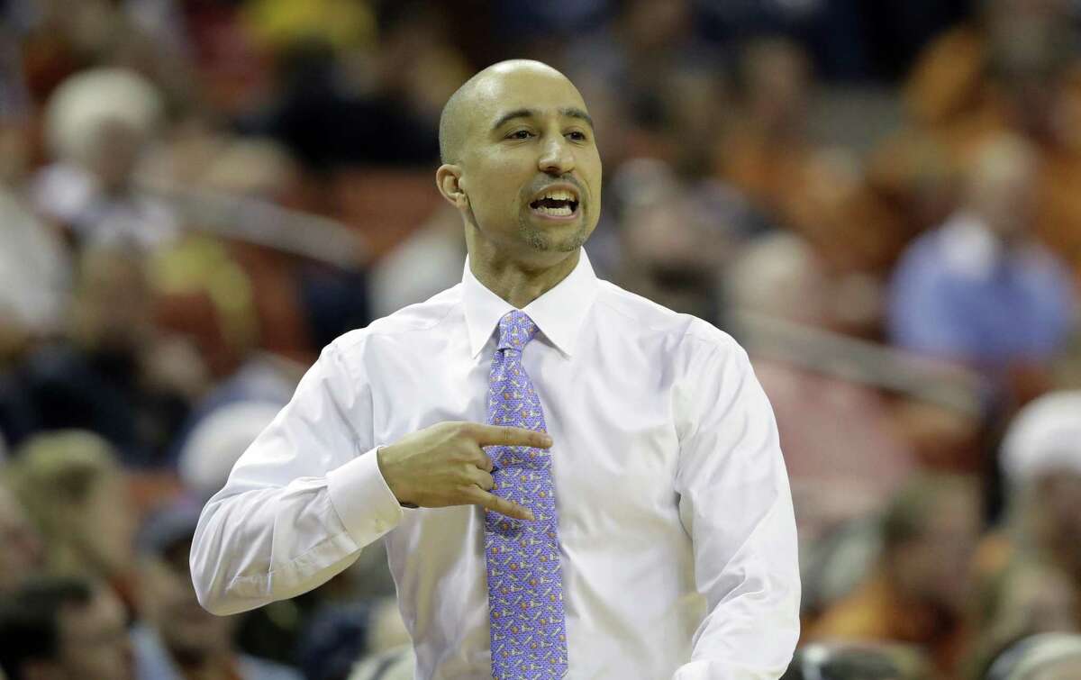 Texas head coach Shaka Smart signals to his players during the first half of an NCAA college basketball game against Iowa State, Monday, Jan. 22, 2018, in Austin, Texas. (AP Photo/Eric Gay)