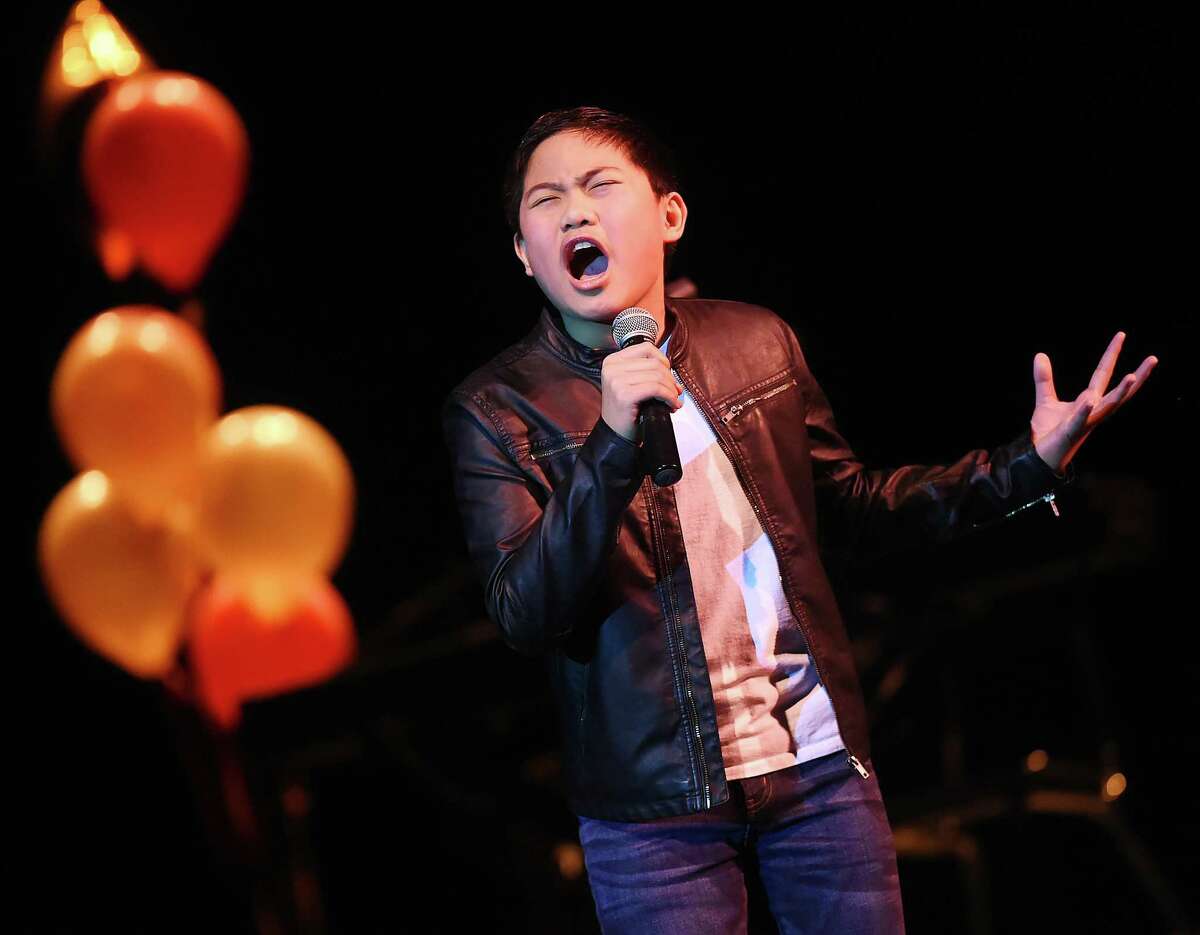 Winner of the junior competition, Lance Matthew Mendoza, a sixth grader at Bear Path School performs "When We Were Young" by Adele at the Voice of Hamden, where ten local vocalists were judged by Linedy Genao, Stacie Morgain Lewis and T. Sean Maher, Thursday at the auditorium at Hamden High School. Director of Fine Arts at the Hamden Public Schools, Eric Nyquist served as master of ceremonies. A special performance by Hamden's Blessing Offor, a singer, songwriter, musician and a contestant on season seven of NBCs The Voice. The Hamden Education Foundation event, sponsored by the Law Office of Jack O'Donnell and all proceeds from the concert will benefit the Hamden public schools.