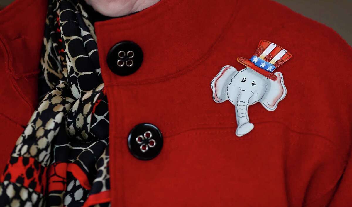 A woman wears an elephant pin while attending the Montgomery County Republican Women's meeting at the River Plantation Country Club, Thursday, Jan. 25, 2018, in Conroe. A look at what Trump voters in Montgomery County think of Trump a year into his presidency.